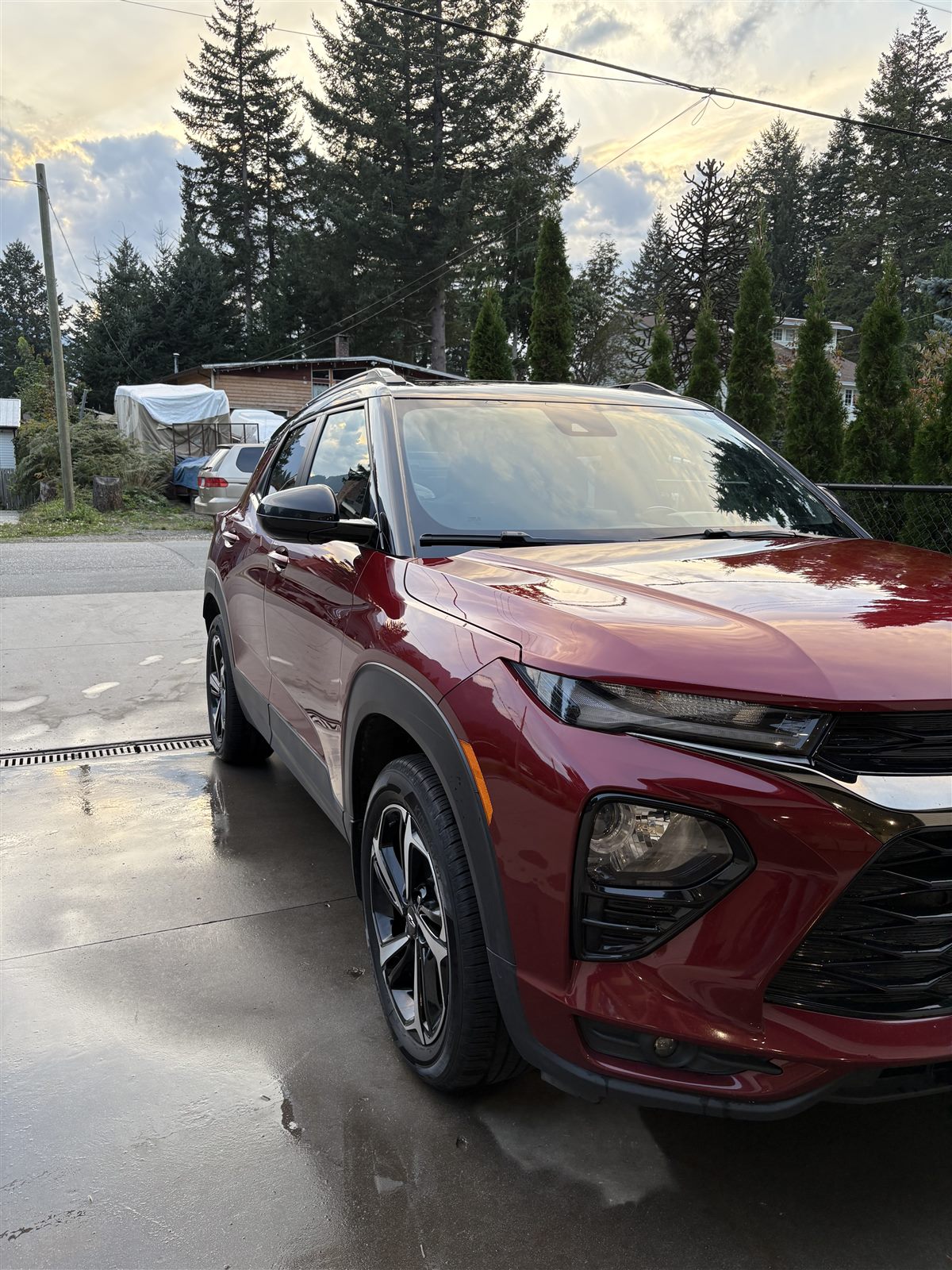 Freshly detailed red Chevrolet Trailblazer in a driveway