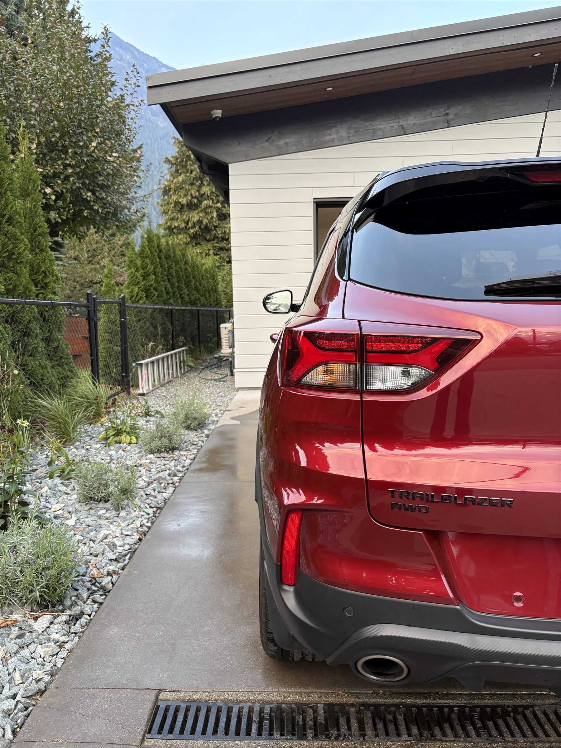 Freshly detailed Chevrolet Trailblazer parked in an Agassiz driveway with the Fraser Valley mountains behind it